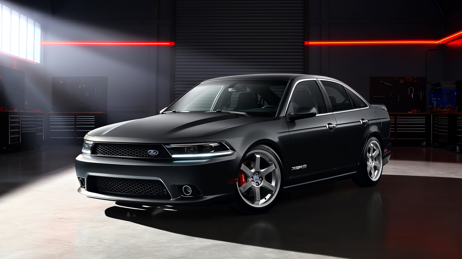 Matte black Ford Falcon FG sedan parked in the Lap Auto workshop